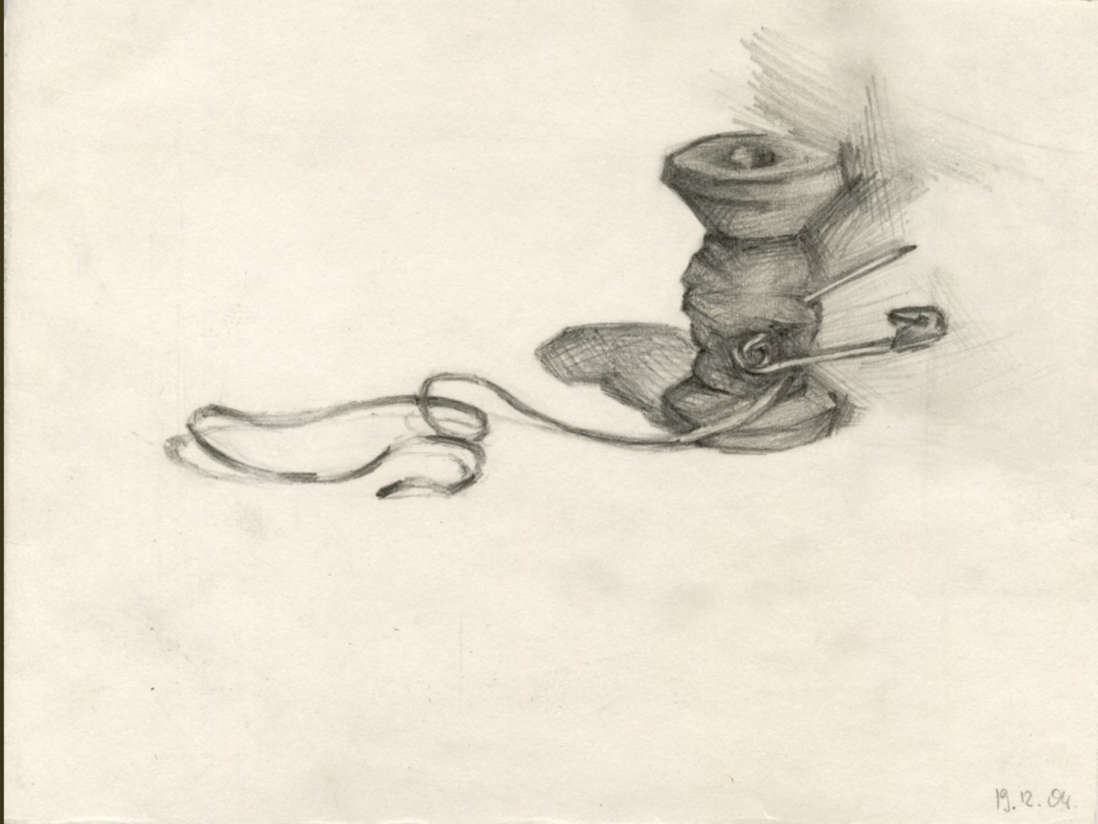 Spool of thread with a pin