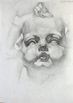 Plaster head of Cupid